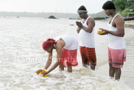 Offering a coconut to the sea